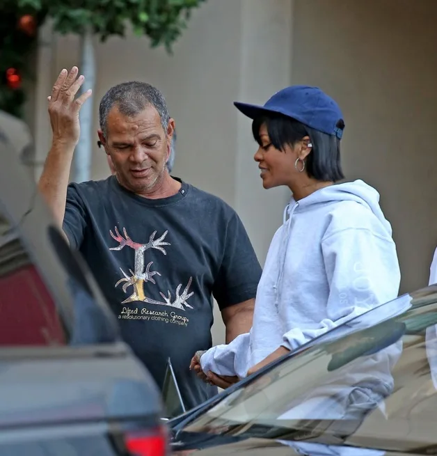 **EXCLUSIVE** Rihanna looks excited as she gets a surprise visit from her dad, Ronald Fenty, while leaving the Montage hotel with best friend Melissa