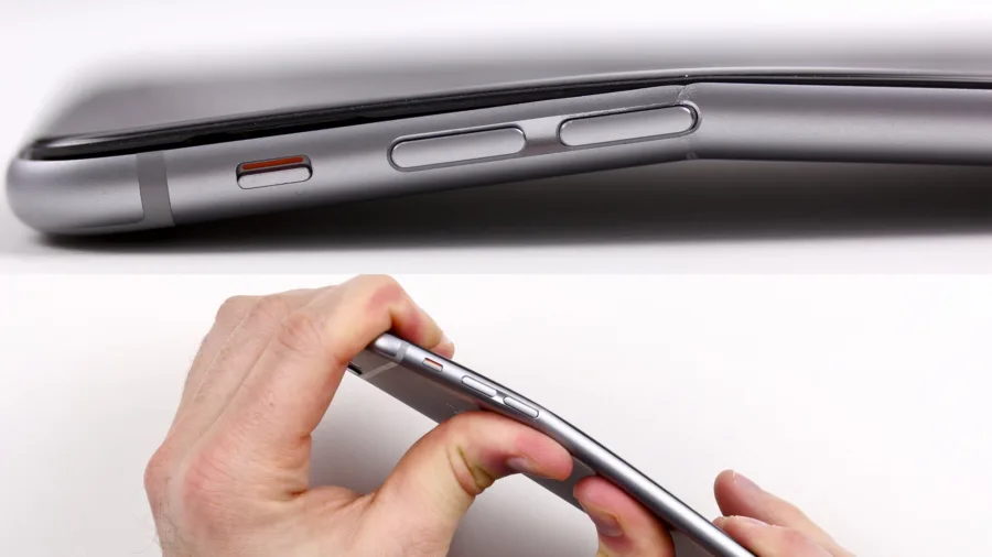 Λυγισμένο iPhone 6 Plus και χέρια που το πιέζουν για να λυγίσει.