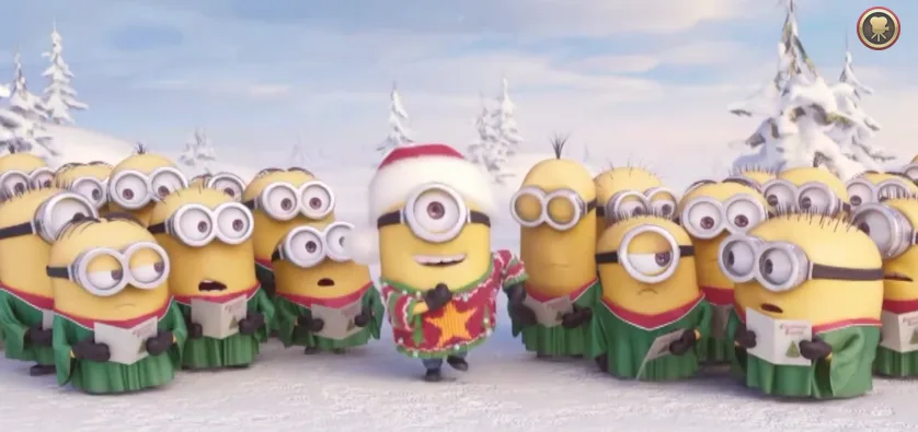 Τα Minions τραγουδούν τα κάλαντα σε χιονισμένο τοπίο.
