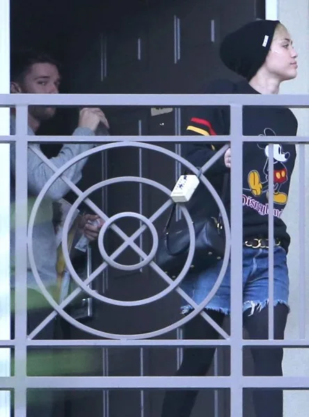 Exclusive... Miley Cyrus Leaving A Mystery Man's Apartment