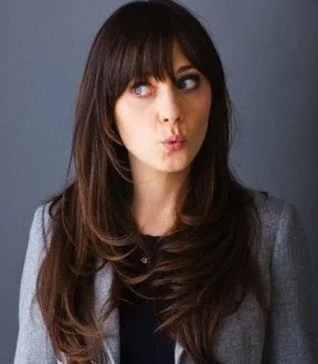 the-zooey-deschanel-bangs-for-layered-long-wavy-brunette-hair