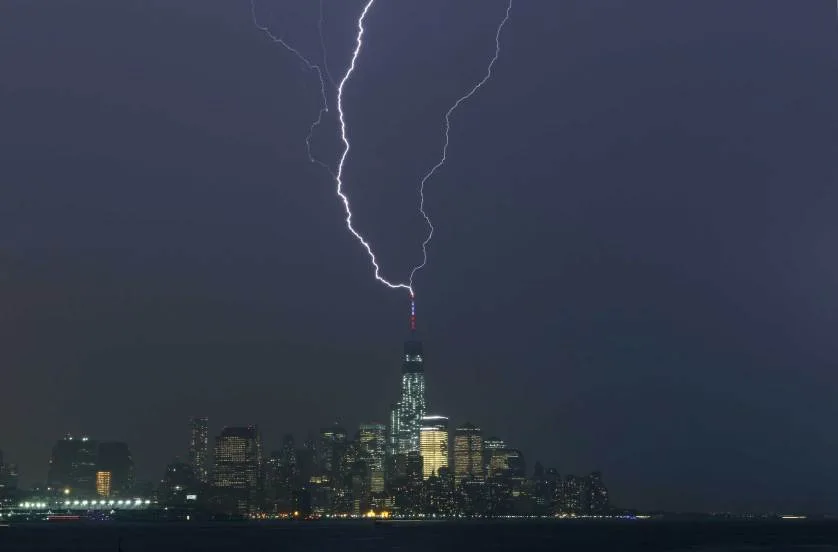 Two bolts of lightning hit the antenna on top of One World Trade Center in Lower Manhattan as an ele