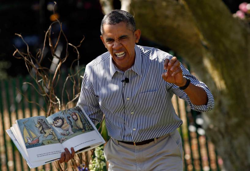 Obama acts out the line "gnashed their terrible teeth" from the children's book "Where the Wild Things Are" during the 136th annual Easter Egg Roll on the South Lawn of the White House in Washington