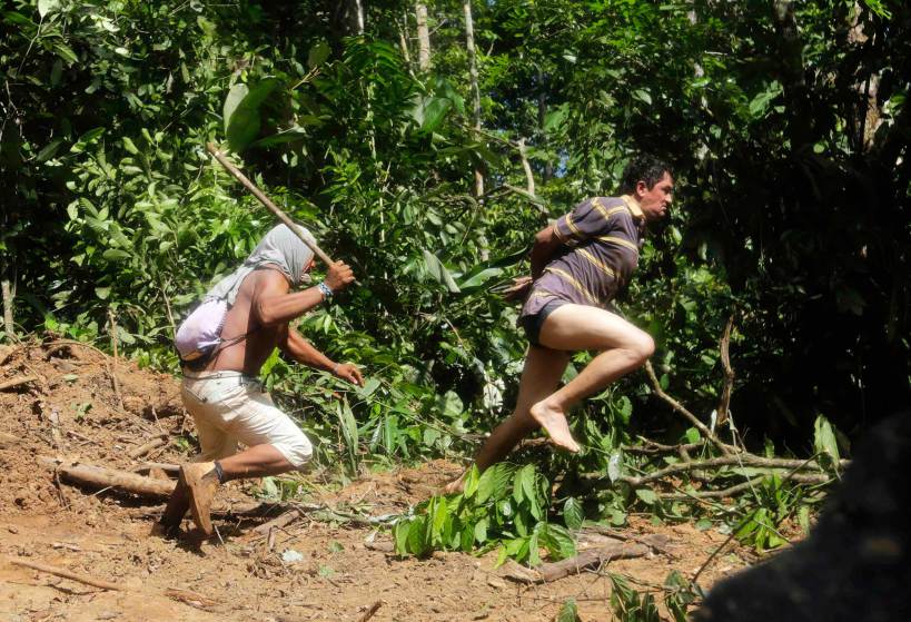 A Ka'apor Indian warrior chases a logger who tried to escape in the Alto Turiacu Indian territory