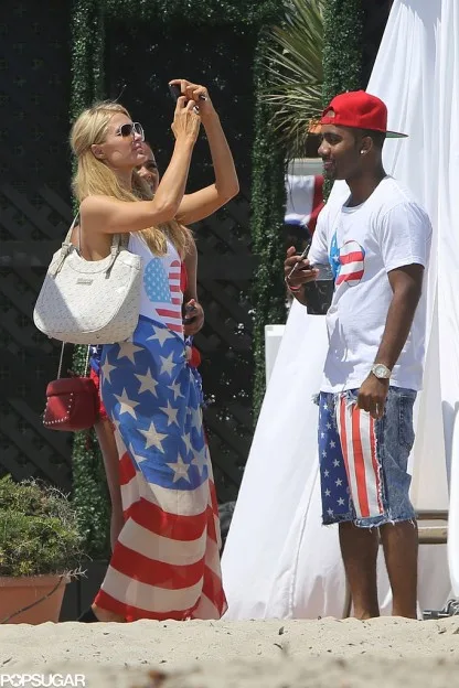Paris-Hilton-took-out-her-phone-during-Fourth-July-fete-2013