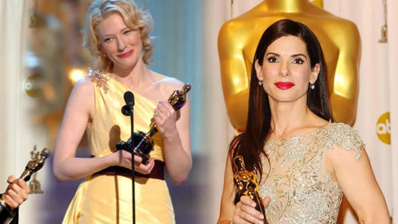 Δύο ηθοποιοί του Hollywood κρατούν βραβεία Όσκαρ φορώντας εντυπωσιακά φορέματα.