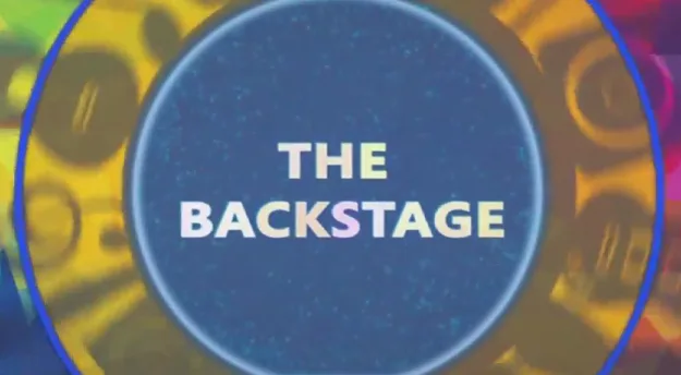 Λογότυπο The Backstage σε μπλε κύκλο για την Ημέρα Θετικής Ενέργειας 2015.