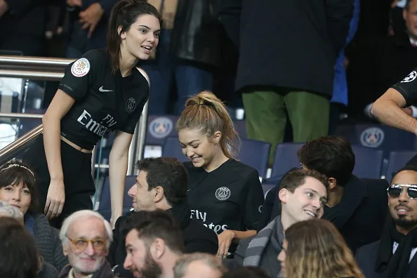 PARIS, FRANCE - OCTOBER 04: Kendall Jenner and Gigi Hadid attends the French Ligue 1 between Paris Saint-Germain and Olympique de Marseille at Parc Des Princes on October 4, 2015 in Paris, France. (Photo by Xavier Laine/Getty Images)