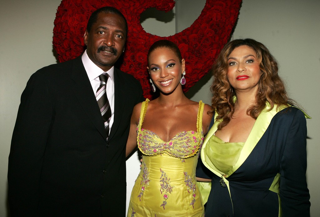 NEW YORK - JUNE 23: (EXCLUSIVE) (L-R) Singer Beyonce Knowles (C) poses with her father and manager Matthew Knowles and her mother Tina Knowles at the "Beyonce: Beyond the Red Carpet auction presented by Beyonce and her mother Tina Knowles along with the House of Dereon to benefit the VH1 Save The Music Foundation June 23, 2005 in New York City. The exhibition will showcase 18-24 costumes worn by Beyonce chronicling her film, television and video appearances. (Photo by Frank Micelotta/Getty Images)