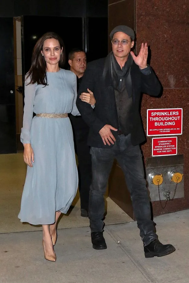 Angelina Jolie and Brad Pitt lock arms with stellar pose out in NYC.Pictured: Angelina Jolie and Brad PittRef: SPL1167955 031115 Picture by: @PapCultureNYC / Splash NewsSplash News and PicturesLos Angeles: 3