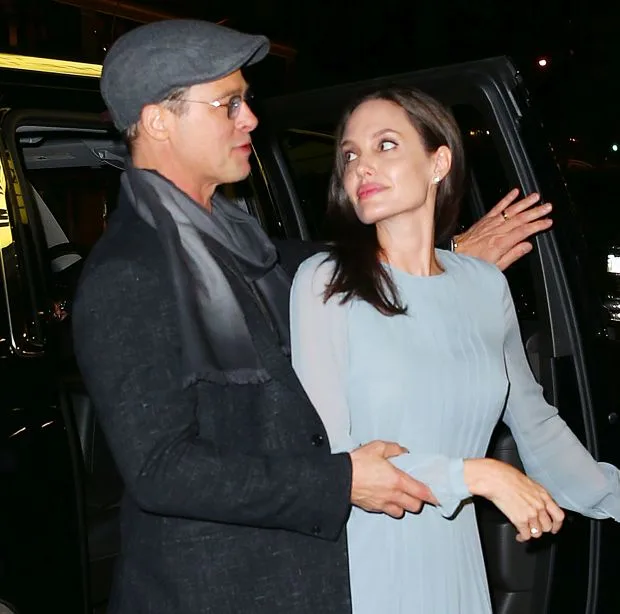 Brad Pitt awkwardly grabs Angelina Jolie at a special screening for their film 'By the Sea' in NYCPictured: Brad Pitt, Angelina JolieRef: SPL1168796 031115 Picture by: Jackson Lee/SplashSplash News and Pictures<BR