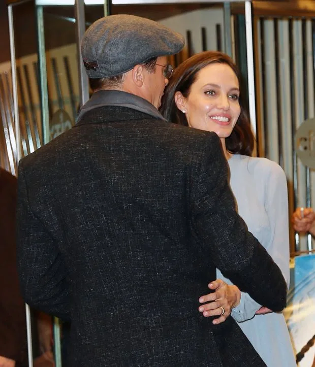 Brad Pitt awkwardly grabs Angelina Jolie at a special screening for their film 'By the Sea' in NYCPictured: Brad Pitt, Angelina JolieRef: SPL1168796 031115 Picture by: Jackson Lee/SplashSplash News and Pictures<BR