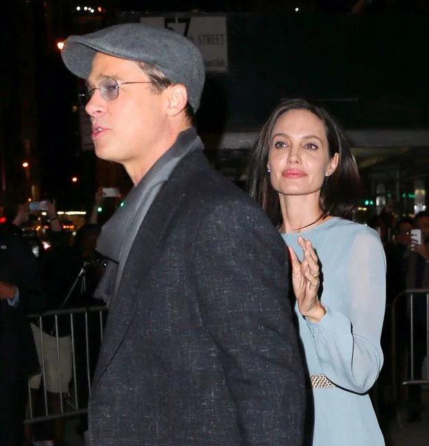 Brad Pitt awkwardly grabs Angelina Jolie at a special screening for their film 'By the Sea' in NYCPictured: Brad Pitt, Angelina JolieRef: SPL1168796 031115 Picture by: Jackson Lee/SplashSplash News and Pictures<BR