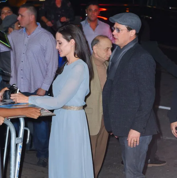 Angelina Jolie and Brad Pitt sign autographs and take pictures with fans as they arrive to the screening of their movie "By the sea" at the "Directors Guild of America" theatre in Midtown, NYCPictured: Angelina Jolie and Brad Pitt Ref: SPL1168928