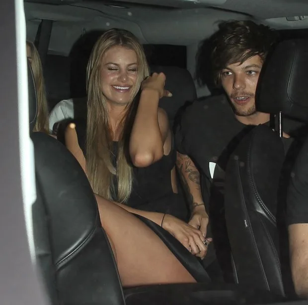 UK CLIENTS MUST CREDIT: AKM-GSI ONLY Louis Tomlinson and Briana Jungwirth enjoyed a late night out at Snoop Dogg's 'Bush' album release party held at DBA Nightclub. The One Direction star kept his look simple as he wore a black Adidas tee, skinny black jeans and a pair of Converse high tops. He gave his thumbs up of approval before he loaded up into his awaiting limo. Pictured: Louis Tomlinson and Briana Jungwirth Ref: SPL1023637 110515 Picture by: AKM-GSI / Splash News