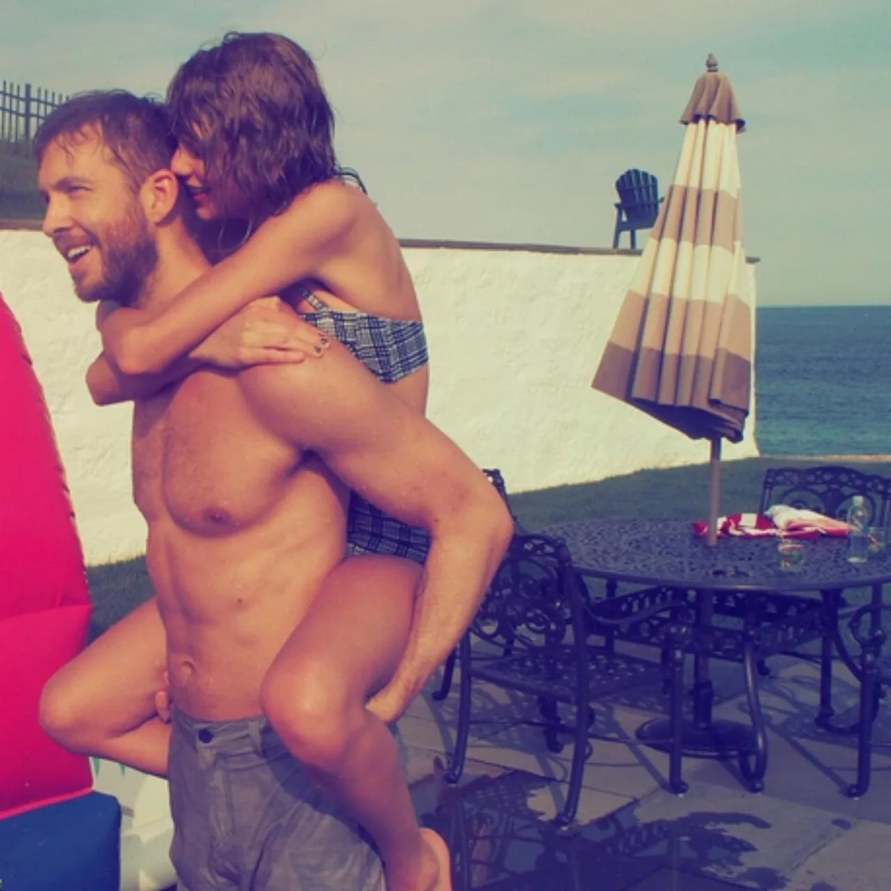 Taylor Swift and Calvin Harris piggy back