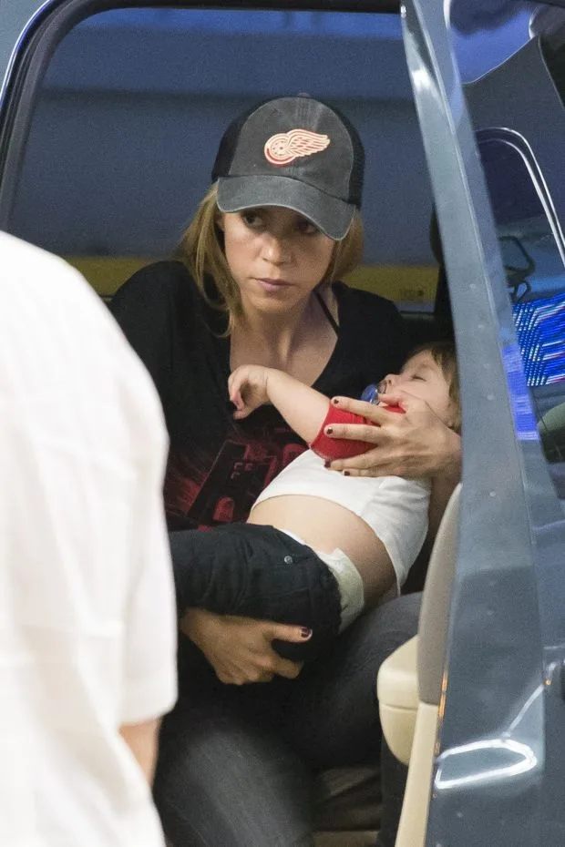 EXCLUSIVE: Shakira makes her way through Miami airport with her two sons Milan and Sasha.