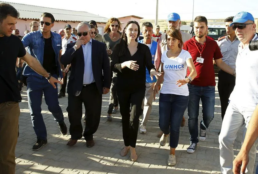 United Nations High Commissioner for Refugees (UNHCR) Special Envoy Angelina Jolie (C) arrives at a Syrian and Iraqi refugee camp in the southern Turkish town of Midyat in Mardin province, Turkey, June 20, 2015. REUTERS/Umit Bektas