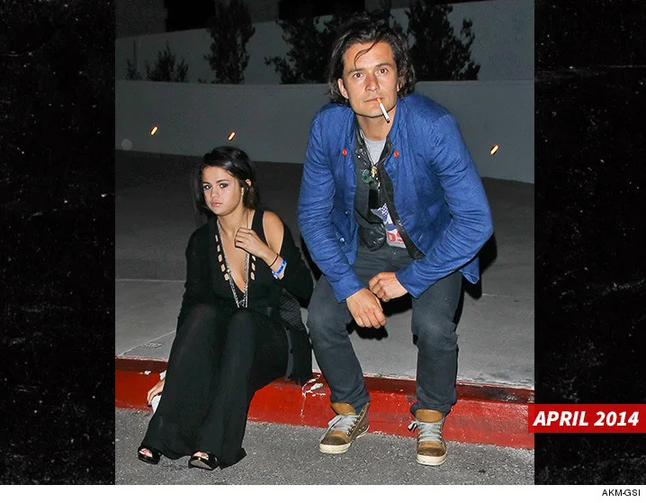 0510-selena-gomez-orlando-bloom-smoking-april-2014-together-akmgsi-4