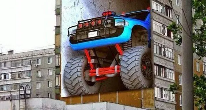 Τρισδιάστατο graffiti με μπλε monster truck σε πολυκατοικία