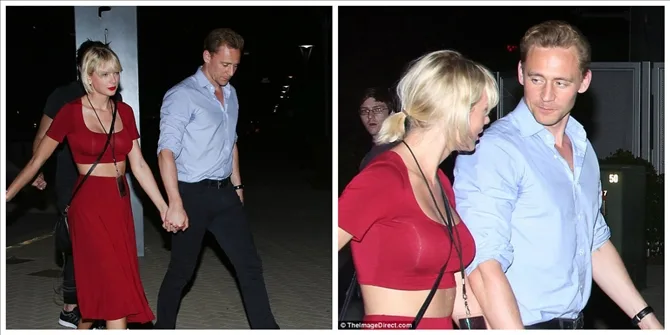 Η Taylor Swift και ο Tom Hiddleston περπατούν χέρι-χέρι το βράδυ.