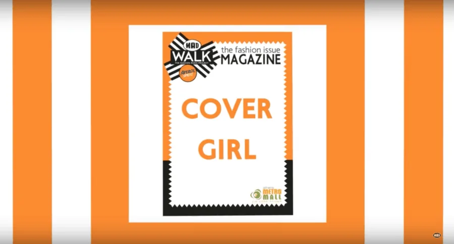 Λογότυπο MadWalk Magazine Cover Girl σε πορτοκαλί φόντο