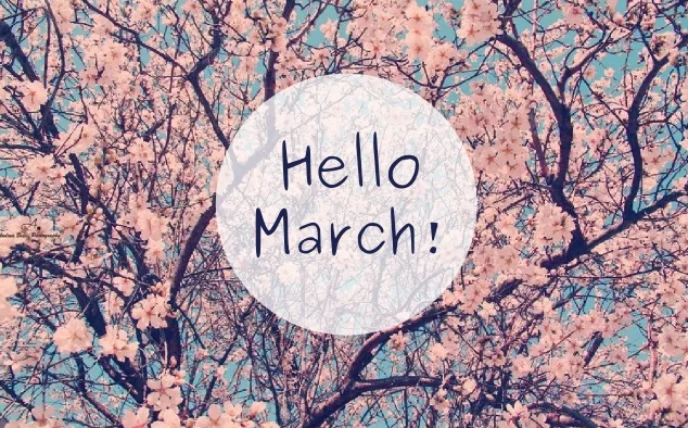Ανθισμένες αμυγδαλιές με το μήνυμα Hello March σε λευκό κύκλο.
