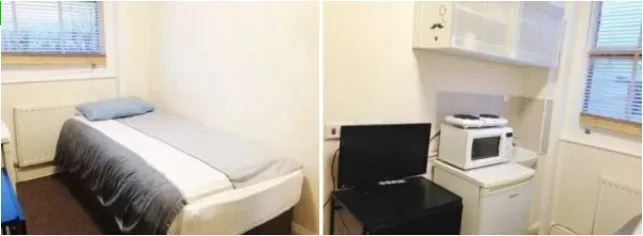 Μικρό δωμάτιο με κρεβάτι και μικρή κουζίνα.