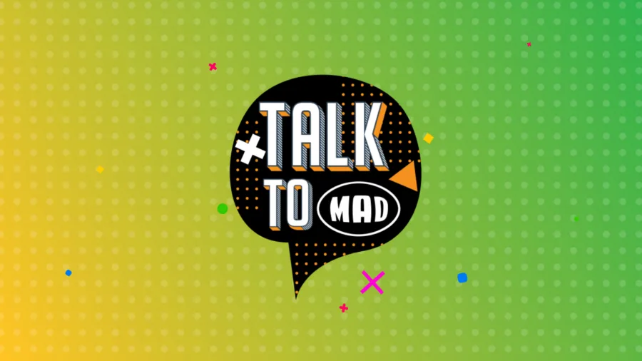 Λογότυπο της εκπομπής Talk to Mad σε μαύρο συννεφάκι ομιλίας.