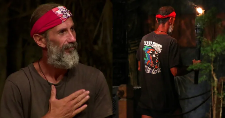 Παίκτης του Survivor με γκρίζα γενειάδα και κόκκινη μπαντάνα σε νυχτερινό πλάνο.