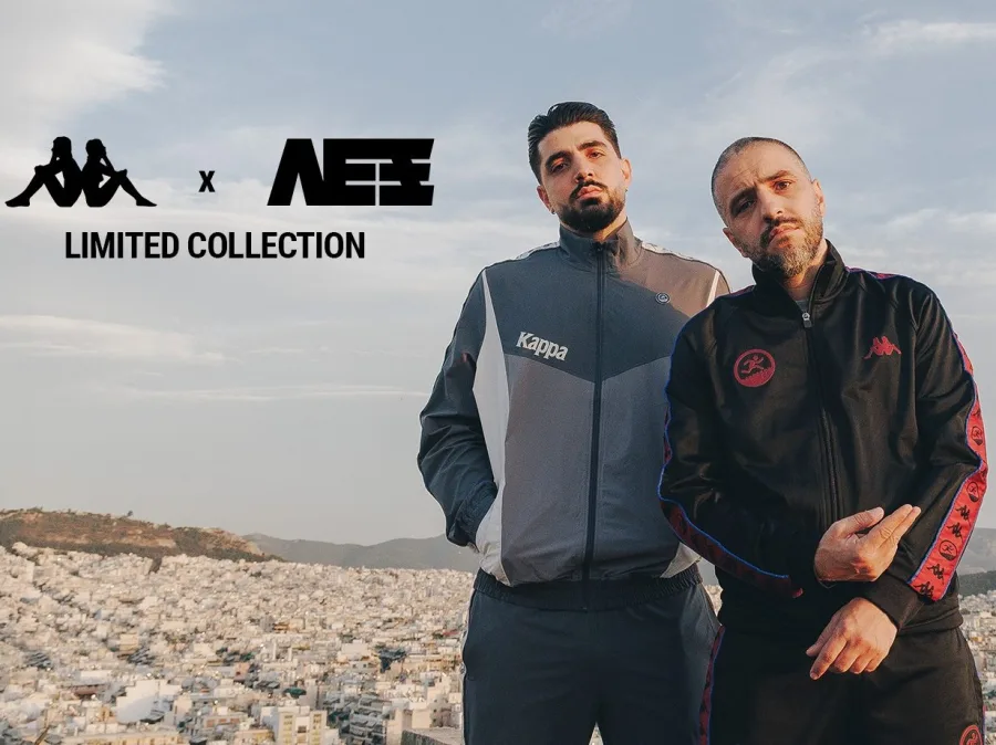 Ο ΛΕΞ και ένας άνδρας με αθλητικές φόρμες Kappa σε φόντο με θέα την πόλη.