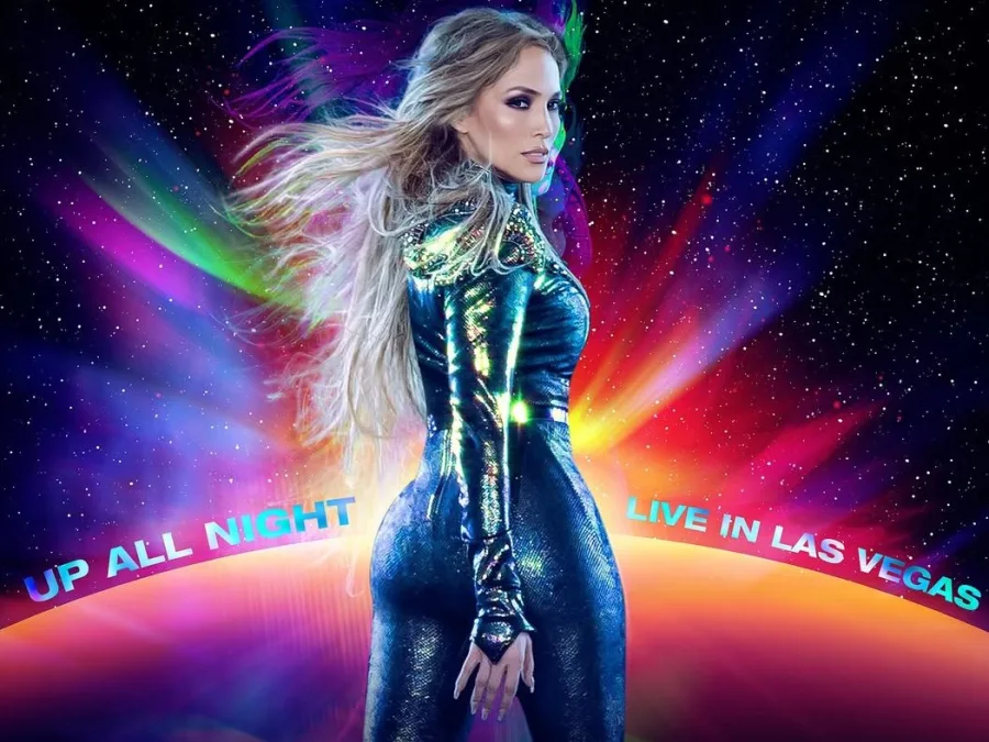 Η Jennifer Lopez με αστραφτερή ολόσωμη φόρμα σε πολύχρωμο φόντο.