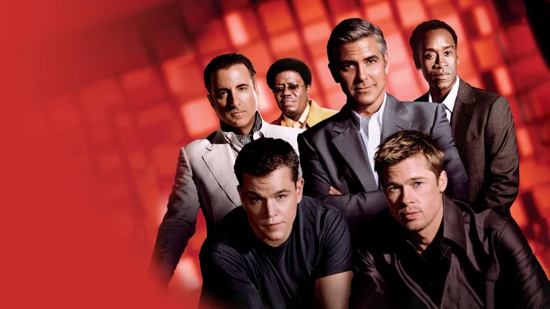 Ο George Clooney και το καστ της ταινίας Ocean’s Eleven σε κόκκινο φόντο.