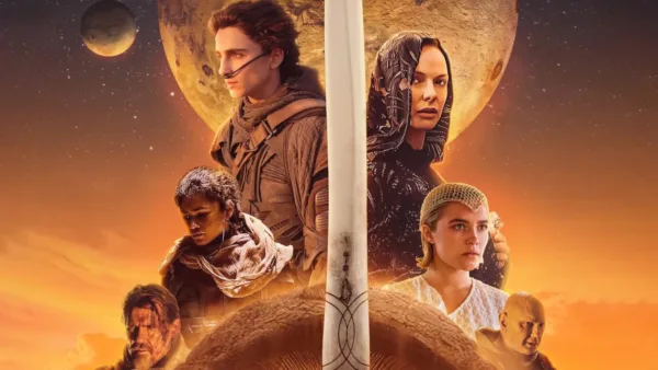 Αφίσα της ταινίας Dune με τον Timothée Chalamet και άλλους ηθοποιούς σε πορτοκαλί φόντο.